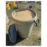 Rubbermaid Garbage can full of animal bedding