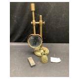 Bell, lighter and magnifying glass