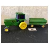 Plastic John Deere tractor and metal wagon