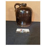 Brown shoulder jug (chipped)