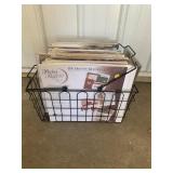 Wire basket full of scrapbooking pages