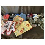 Glassware and Kutcher hot pads and tablecloth
