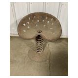 Tractor seat on spring