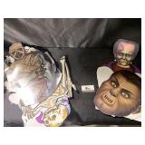 Tote of Halloween masks and decor