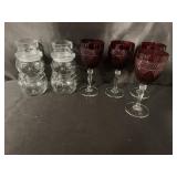 8 red goblets and 2 glass snowmen