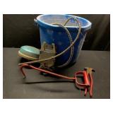 Heated bucket, tank heater, gate latch