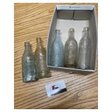 Old pop bottles a Perry Iowa