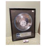 Silver record presented to KJJY David Ball