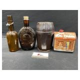 Vintage glass bottles, tin, and crock