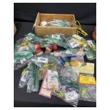 Wooden box full of fishing tackle