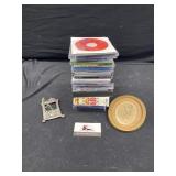 CDs, pewter frame, and picture