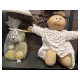 Cabbage patch doll and wax bear