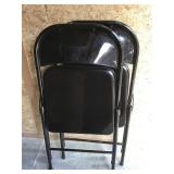 Two metal folding chairs