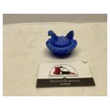 Miniature hen on a nest