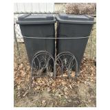 Two trash cans with straw for bedding