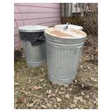 Three galvanized trash cans