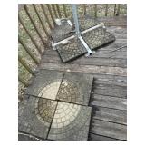 Eight garden pavers in umbrella stand