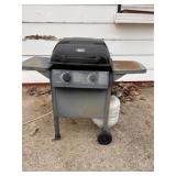 Grill and propane bottle