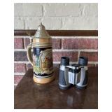 Beer stein and binoculars
