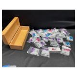 Approximately 30 packaged pairs of dinosaur