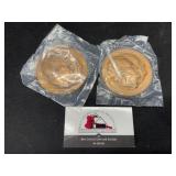 Two Franz Nixon metals.