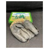 Vintage glove and John Deere tin