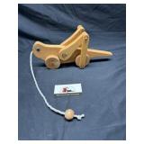 Hand carved grass hopper pull toy