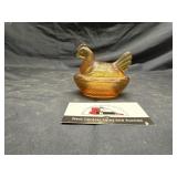 Amber glass hen on nest