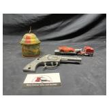 Vintage noise maker, toy gun, and matchbox semi