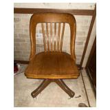 Vintage wooden rolling desk chair