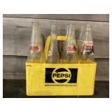 Plastic Pepsi crate with glass bottles