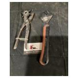 Leather punch and adjustable wrench
