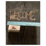 Cast-iron welcome sign