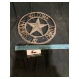 Cast-iron welcome sign