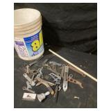 Bucket of miscellaneous wrenches