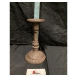 Cast-iron candleholder approximately 9 inches tall