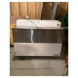 Milk cooler on wheels bring help to load without