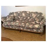 Wooden footed floral pattern couch