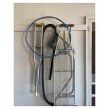 Metal ironing board and crutches