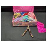 Barbie clothes and case