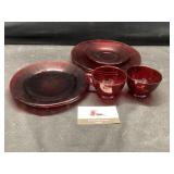 Red glassware plates and mugs