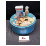 Tin with bandaid tin and vitamin jar