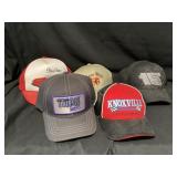 Assorted racing hats