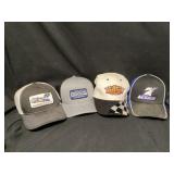 Assorted racing hats