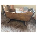 Wooden doll cradle and bedding