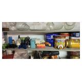 Shelf of tins and glass decor