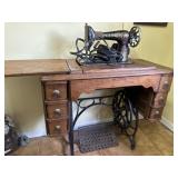 Singer sewing machine in cabinet