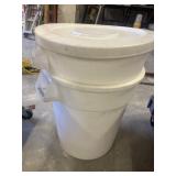 2 white BRUTE trash cans