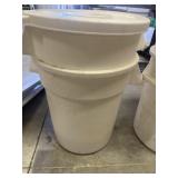 2 white BRUTE trash cans