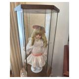Doll in display case